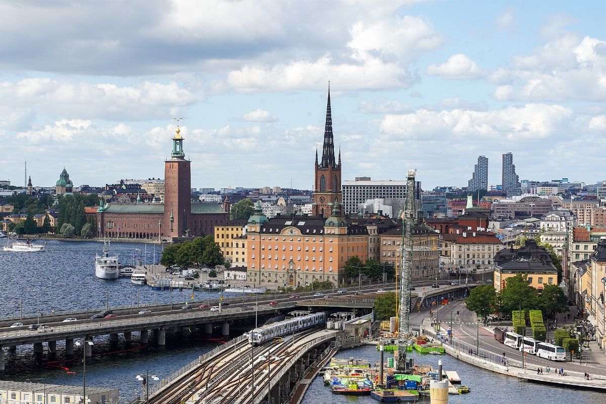 Gamla Stan tunnelbanestation, Centralbron, Riddarfjärden, Stadshus, Riddarholmskyrkan and Norra tornen, Stockholm, Sweden